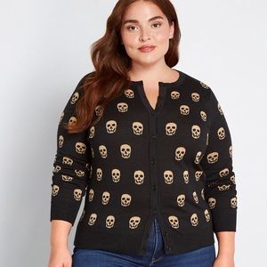 It’s a skull world cardigan sweater gold black 1X
